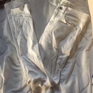 White jeans with holes on the knees